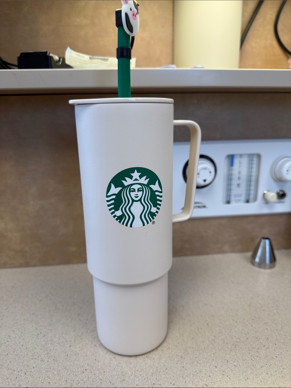 Starbucks white tumbler with green logo and handle